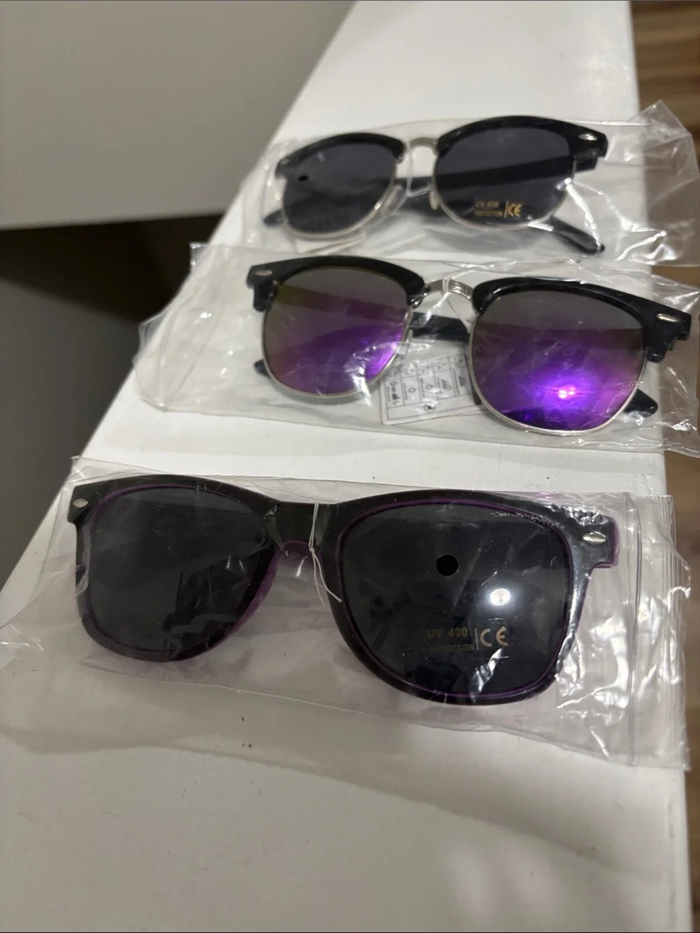 3 pair owl sunglasses with tags.